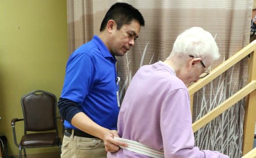 Director of Therapy, Garry Gumasing, working with a neuromuscular rehabilitation patient.