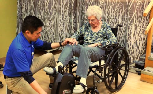 Directory of Therapy, Garry Gumasing, working with a physical therapy patient.
