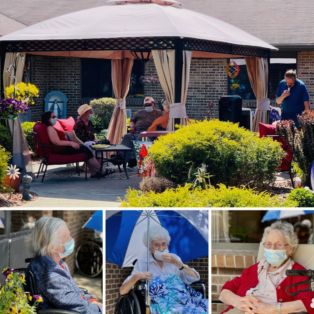 Residents enjoying music in the courtyard with Chuck Hockema